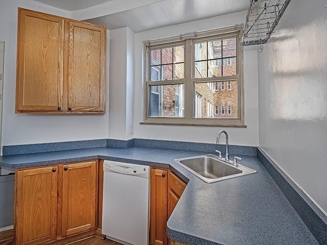 144 N Dithridge St Unit 510, Oakland, PA 15213 - kitchen featuring a sink, dark countertops, dishwasher, and brown cabinets