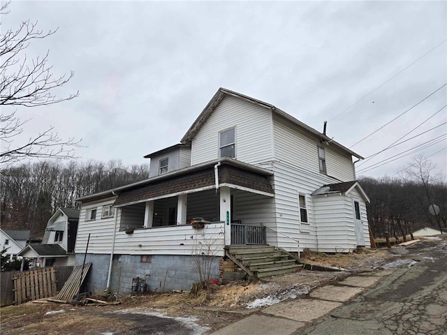 104 Forrest St, Petrolia, PA 16050 - view of front facade with a porch and fence