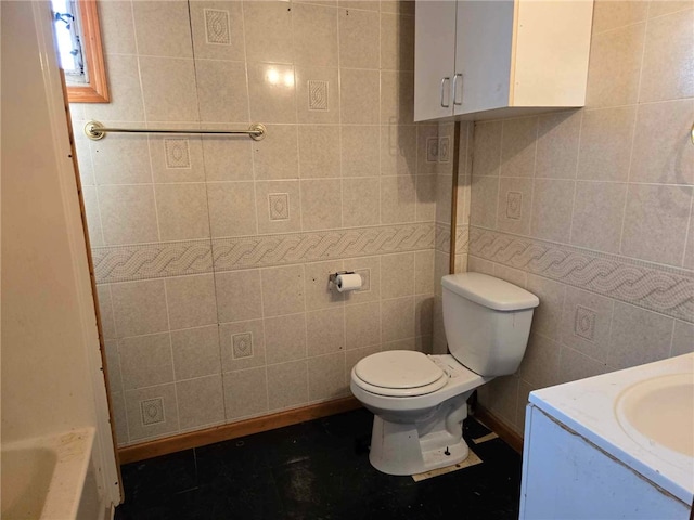 104 Forrest St, Petrolia, PA 16050 - bathroom with tile walls, toilet, a bathtub, and vanity
