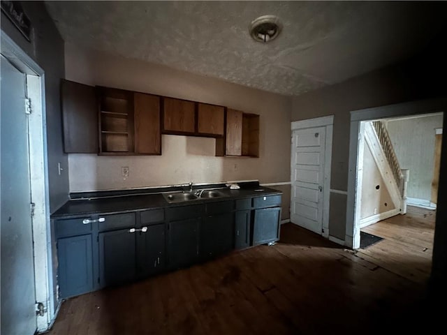 801 Butler Ave, New Castle/4Th, PA 16101 - kitchen featuring a sink, dark wood-type flooring, dark countertops, and open shelves