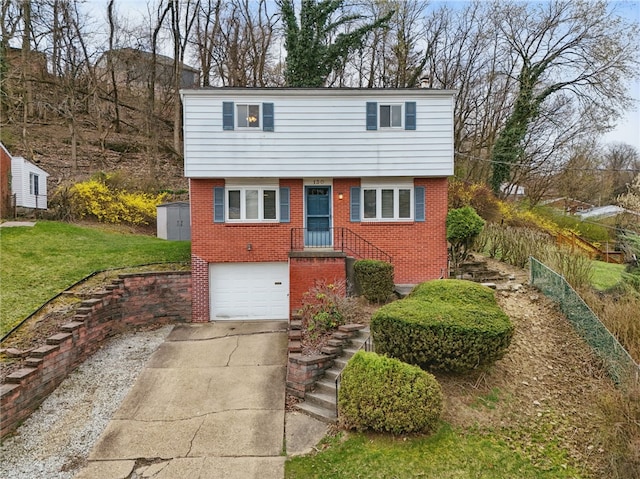 130 Shiela Dr, Green Tree, PA 15220 - view of front of home with brick siding, driveway, a garage, and a front yard