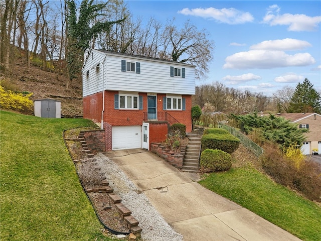 130 Shiela Dr, Green Tree, PA 15220 - view of front facade featuring brick siding, concrete driveway, a garage, a shed, and a front yard
