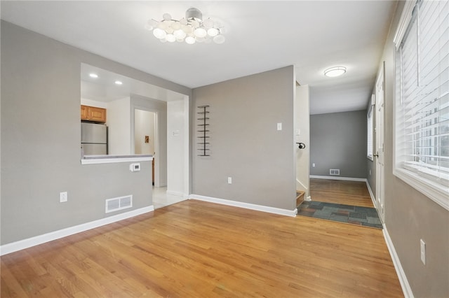130 Shiela Dr, Green Tree, PA 15220 - empty room featuring light wood-style floors, a chandelier, baseboards, and recessed lighting