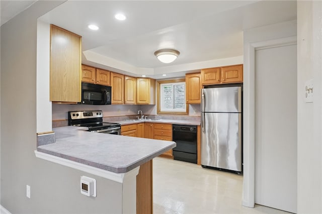 130 Shiela Dr, Green Tree, PA 15220 - kitchen with black appliances, a sink, light flooring, a peninsula, and light countertops