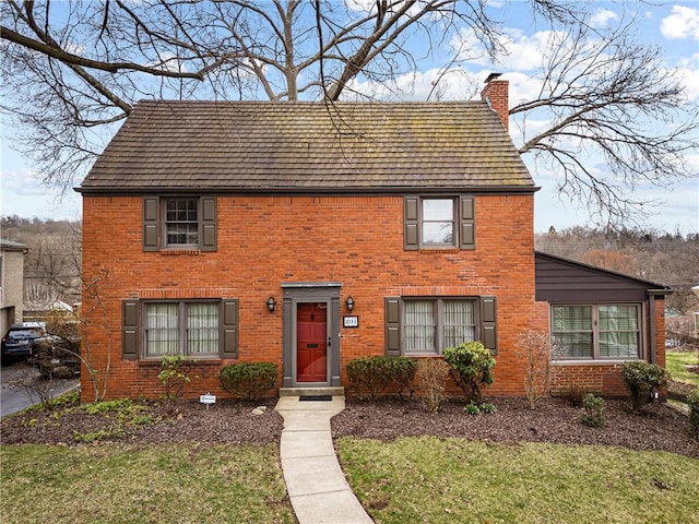201 Vernon Dr, Mt Lebanon, PA 15228 - colonial home featuring brick siding, a front lawn, and a chimney
