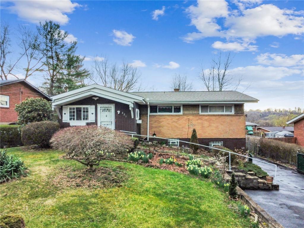 621 Pinefrost Dr, Monroeville, PA 15146 - view of front facade featuring brick siding, a front lawn, and a chimney