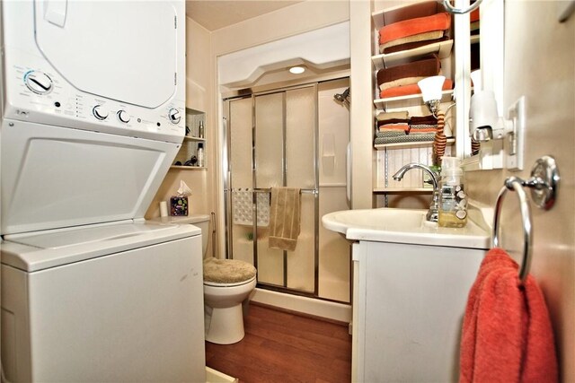 2369 Harrow Rd, Upper St Clair, PA 15241 - laundry room with stacked washing machine and dryer and dark wood-type flooring