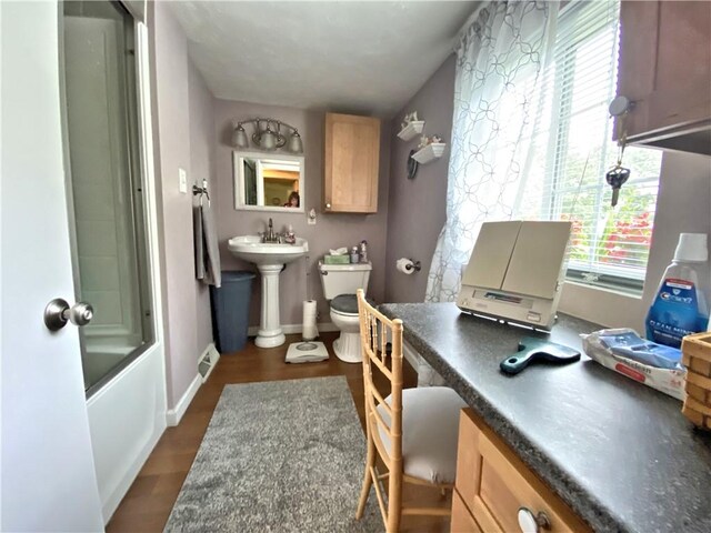 2369 Harrow Rd, Upper St Clair, PA 15241 - full bathroom with healthy amount of natural light, bath / shower combo with glass door, and wood finished floors