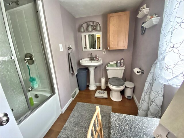 2369 Harrow Rd, Upper St Clair, PA 15241 - full bathroom with combined bath / shower with glass door and wood finished floors