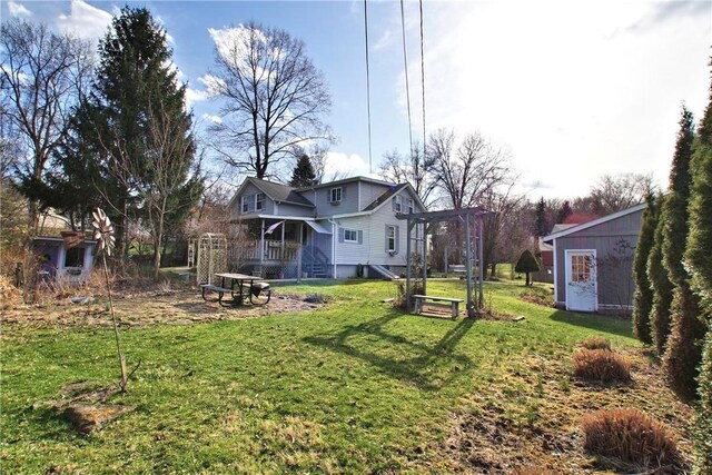 2369 Harrow Rd, Upper St Clair, PA 15241 - view of grassy yard with a porch