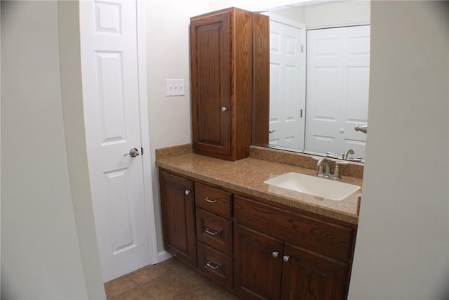 bathroom with vanity and tile patterned flooring