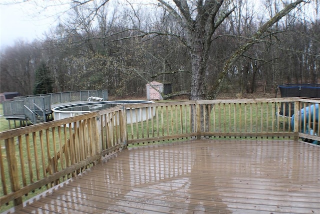 wooden deck with an outdoor pool