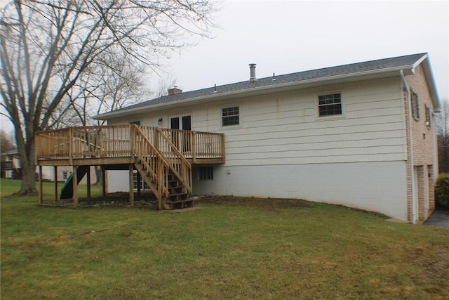 back of property with stairs, a wooden deck, a yard, and a chimney