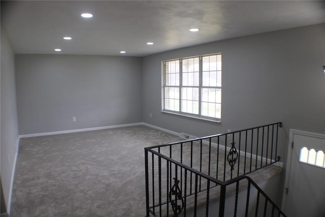stairway with carpet floors, recessed lighting, and baseboards