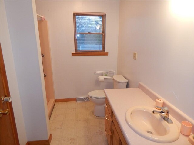 104 N Eberhart Rd, Twp Of But Nw, PA 16001 - bathroom featuring visible vents, vanity, a shower, toilet, and tile patterned floors