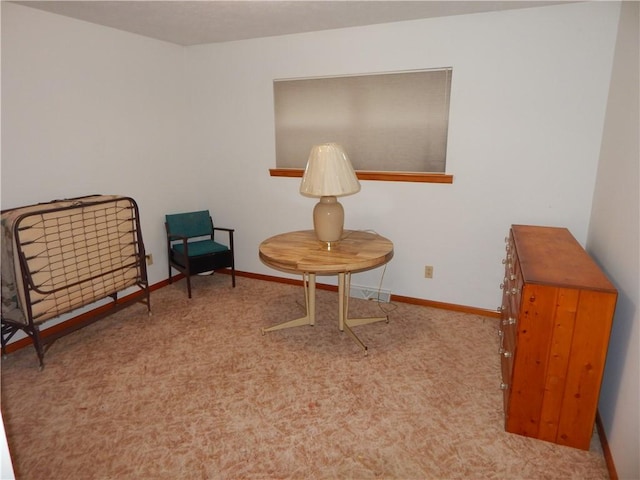 sitting room with carpet flooring and baseboards