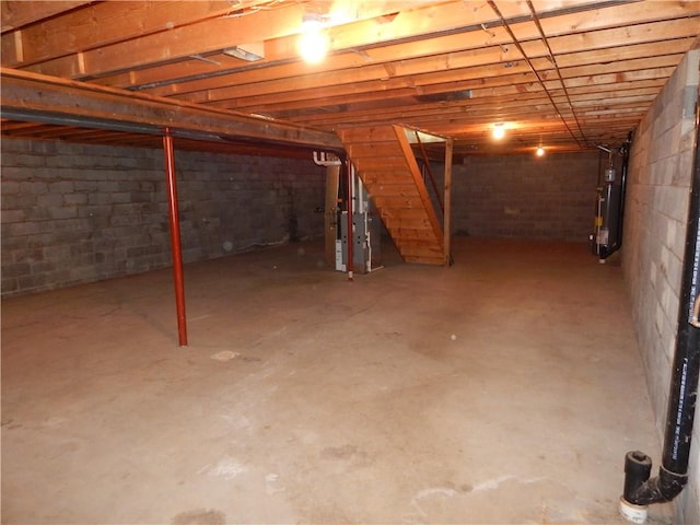 unfinished below grade area with water heater and heating unit
