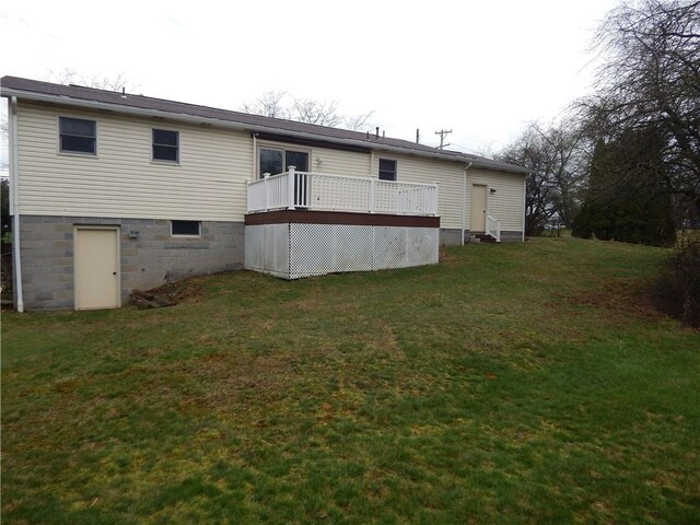 104 N Eberhart Rd, Twp Of But Nw, PA 16001 - back of property featuring a lawn and a wooden deck