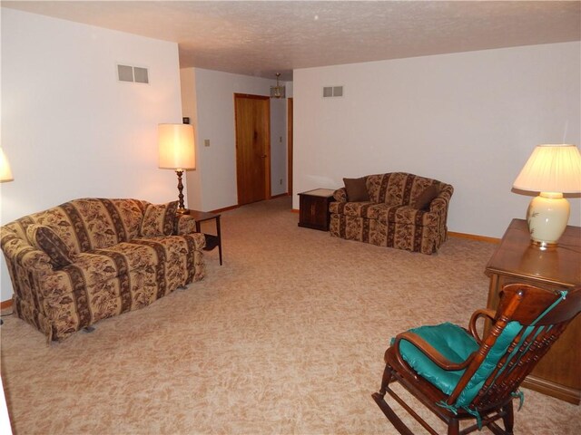 104 N Eberhart Rd, Twp Of But Nw, PA 16001 - living room featuring carpet floors, a textured ceiling, and visible vents