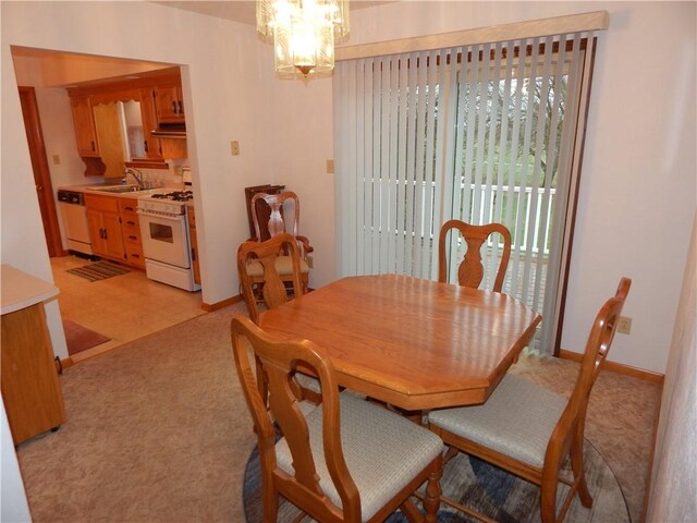 104 N Eberhart Rd, Twp Of But Nw, PA 16001 - dining space with baseboards, an inviting chandelier, and light floors