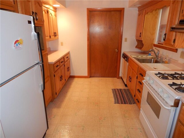 104 N Eberhart Rd, Twp Of But Nw, PA 16001 - kitchen with a sink, white appliances, light countertops, light floors, and under cabinet range hood