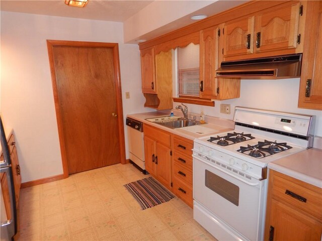 104 N Eberhart Rd, Twp Of But Nw, PA 16001 - kitchen featuring a sink, white gas stove, light floors, under cabinet range hood, and dishwashing machine