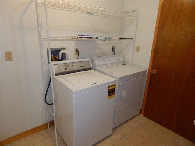 104 N Eberhart Rd, Twp Of But Nw, PA 16001 - laundry room with laundry area, washing machine and dryer, baseboards, and light floors