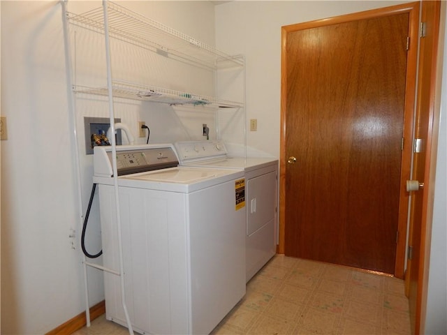 laundry room featuring washer and dryer, laundry area, and light floors