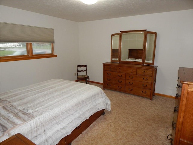 carpeted bedroom with baseboards