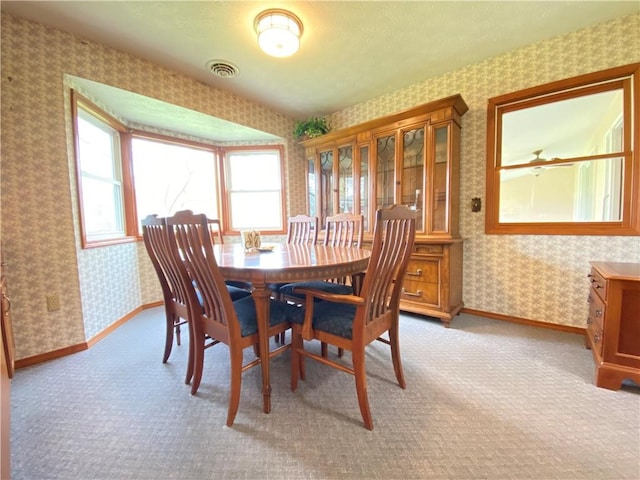7005 N Dr, Shenango-Cra, PA 16134 - dining space with wallpapered walls, light carpet, and baseboards
