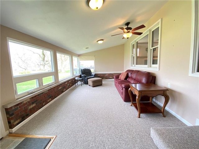7005 N Dr, Shenango-Cra, PA 16134 - sunroom / solarium with carpet floors, brick wall, vaulted ceiling, and baseboards