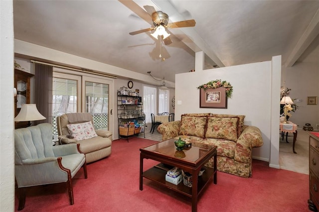 living area featuring carpet flooring, a ceiling fan, and vaulted ceiling with beams