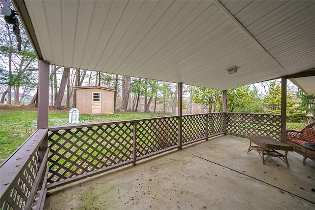 view of patio with an outbuilding and a storage shed