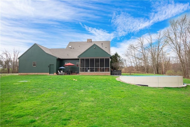 543 Hamburg Rd, Delaware Twp, PA 16154 - rear view of house with a sunroom, a yard, and a chimney