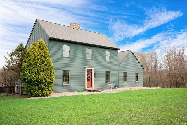 543 Hamburg Rd, Delaware Twp, PA 16154 - rear view of house with a chimney, a yard, and roof with shingles