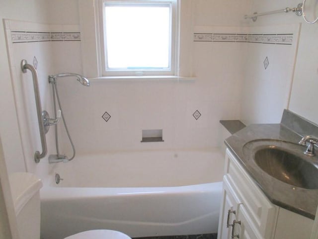 full bath with toilet and vanity