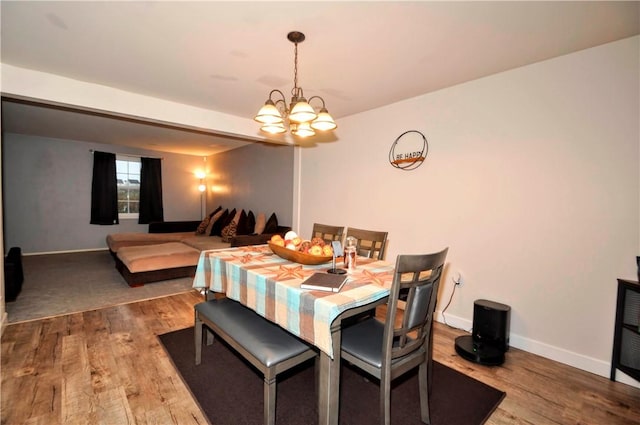 120 Scottsdale Dr, Moon/Crescent Twp, PA 15108 - dining area featuring a chandelier, wood finished floors, and baseboards