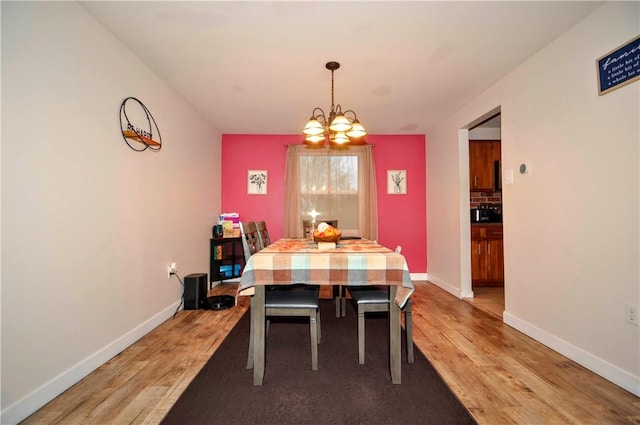 120 Scottsdale Dr, Moon/Crescent Twp, PA 15108 - dining room featuring a chandelier, light wood-style flooring, and baseboards