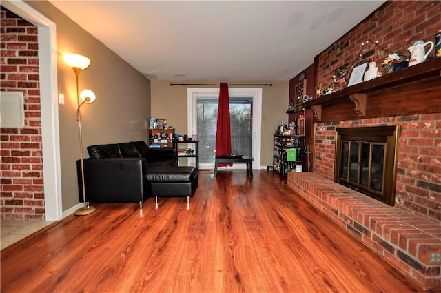 120 Scottsdale Dr, Moon/Crescent Twp, PA 15108 - living room featuring wood finished floors, a fireplace, and baseboards