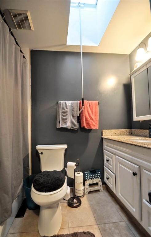 120 Scottsdale Dr, Moon/Crescent Twp, PA 15108 - full bath with a skylight, tile patterned flooring, vanity, and toilet