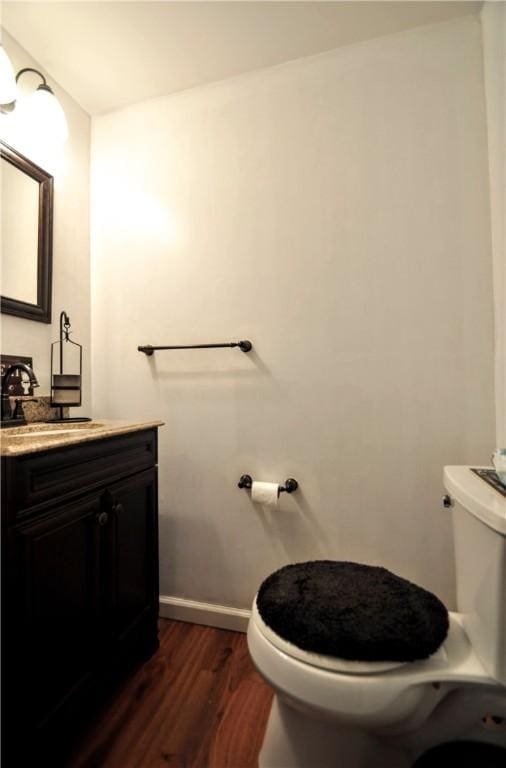 120 Scottsdale Dr, Moon/Crescent Twp, PA 15108 - half bathroom featuring toilet, wood finished floors, vanity, and baseboards