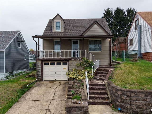 111 Thomas Ave N, Versailles, PA 15137 - view of front facade featuring a garage, concrete driveway, stairway, a shingled roof, and a porch