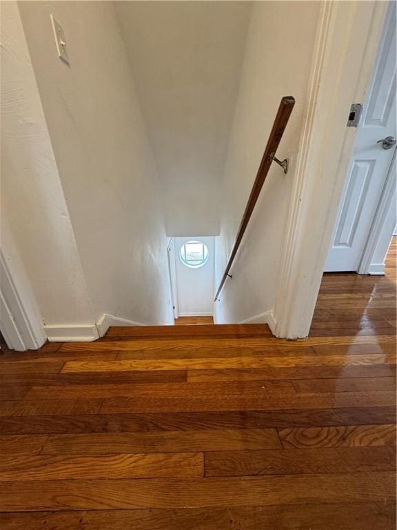 stairway featuring hardwood / wood-style floors