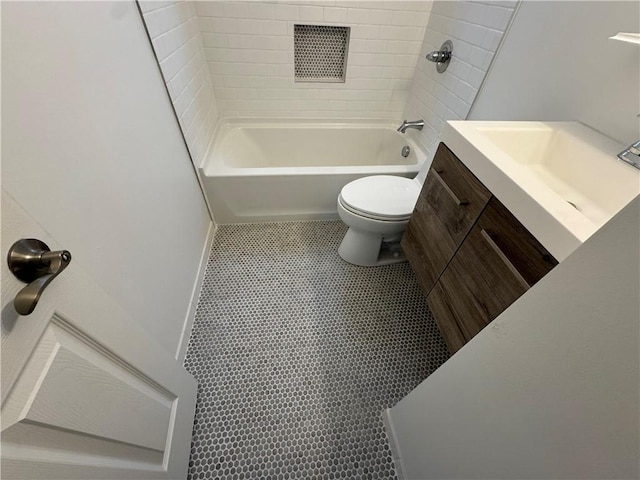 bathroom featuring toilet, vanity, washtub / shower combination, and visible vents