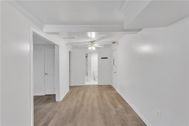 hall with baseboards, light wood-style flooring, and ornamental molding