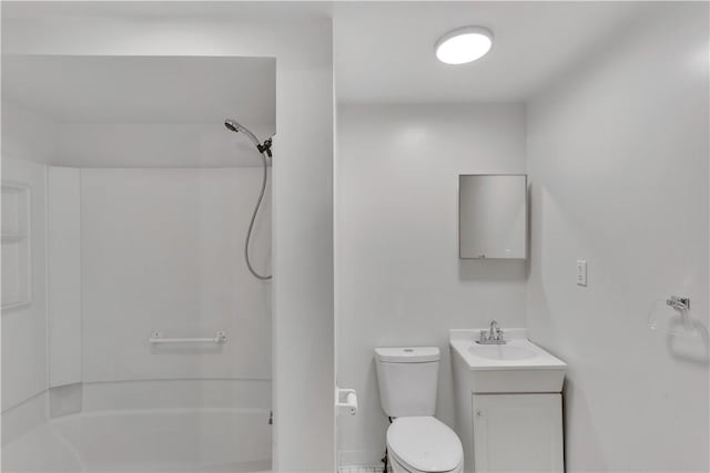 bathroom featuring toilet, vanity, and shower / bath combination