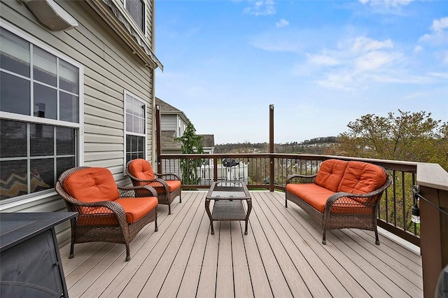 wooden deck with an outdoor living space