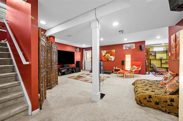 carpeted living area featuring recessed lighting, visible vents, and stairway