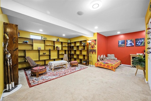 sitting room with carpet floors, recessed lighting, and baseboards