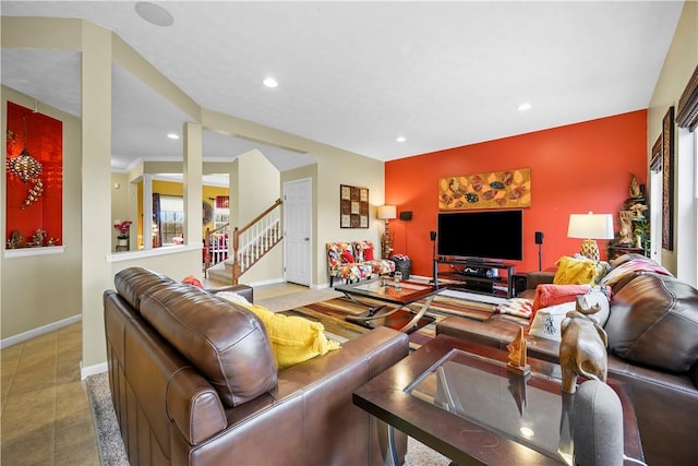 living area with baseboards, recessed lighting, stairs, and tile patterned floors